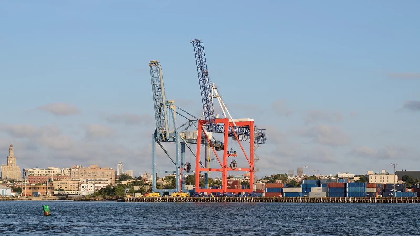 Container gantry cranes and stacked boxes on a terminal quay